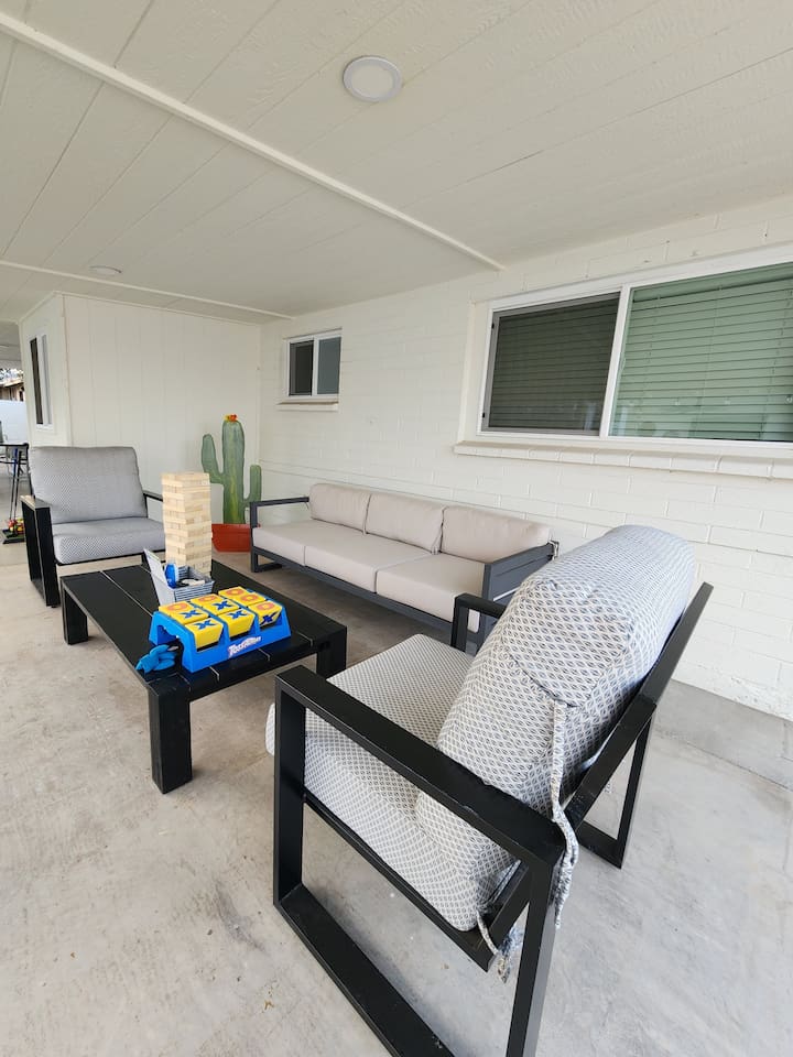 Additional covered outdoor lounge space with comfortable seating and tabletop games. Perfect extra space for relaxation, conversation and fun.
