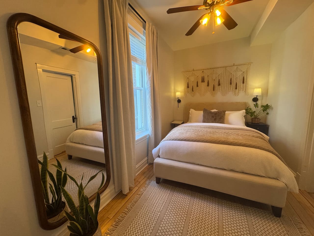 Bright bedroom with cozy design and comfortable mattress.