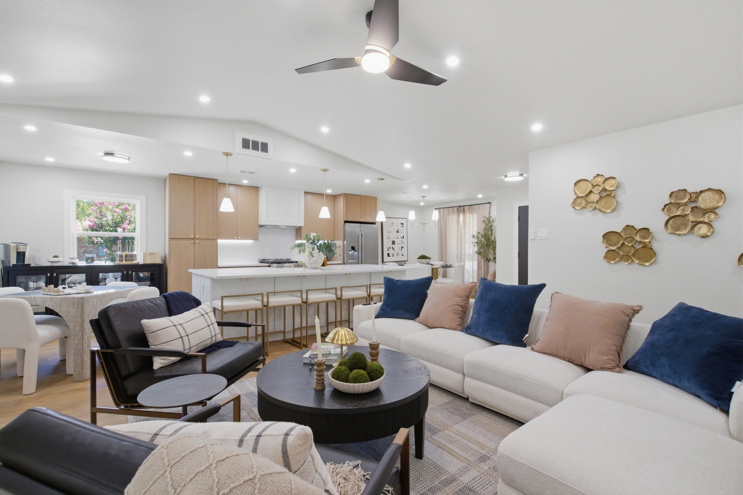 Open-Concept Layout connects the living room, kitchen, and dining area into one bright, vaulted space. Built for entertaining groups and families.