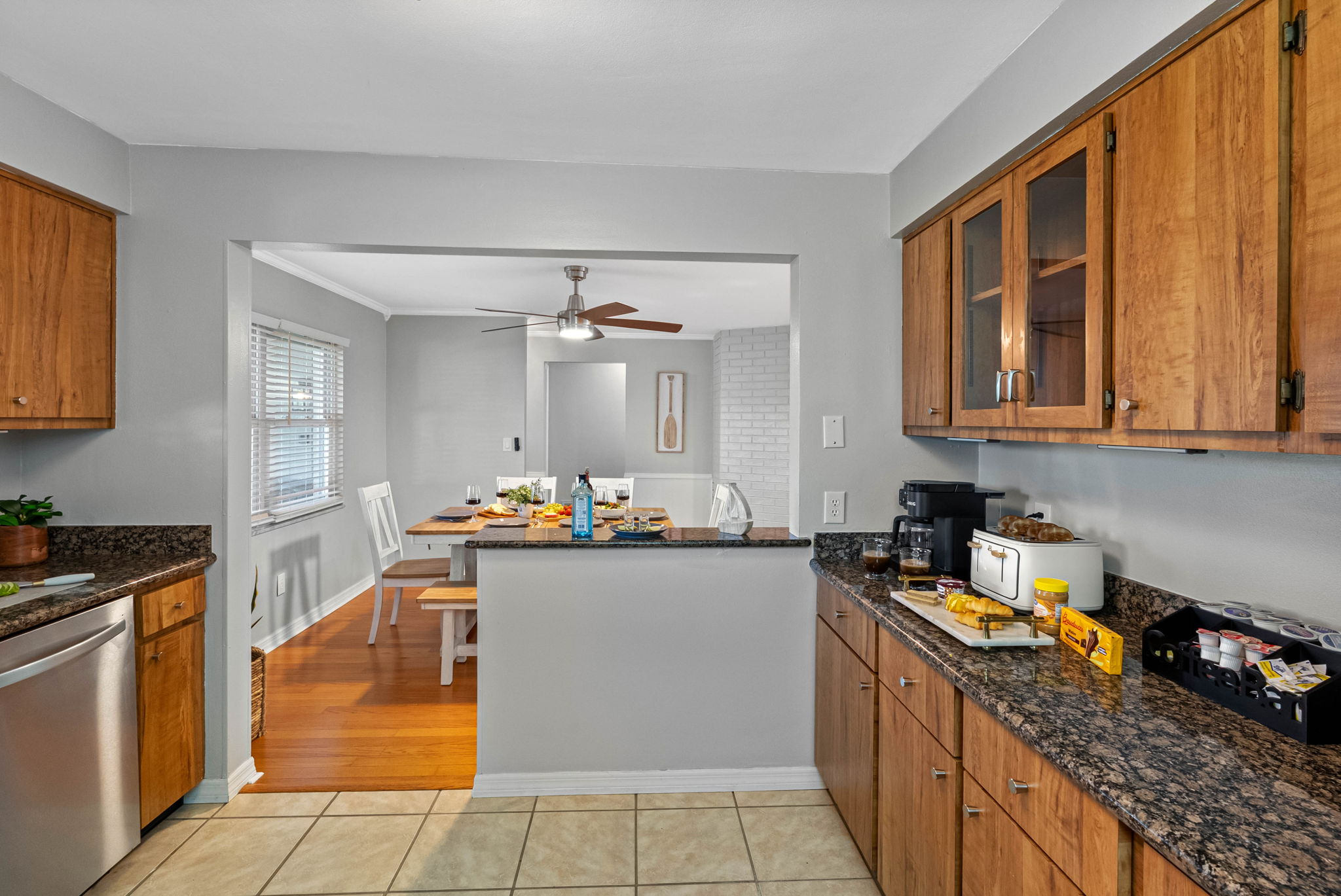 Gather, dine, and connect in this coastal-chic dining space with seating for six and easy flow to the kitchen.