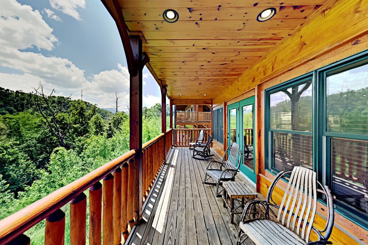 Upper deck with rocker chairs and a view of Mt. LeConte