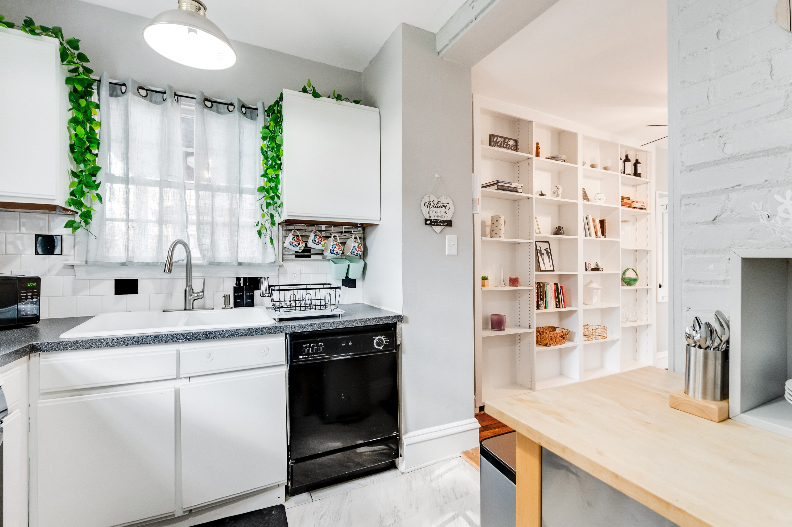 Kitchen Delight: Natural light dances through the windows, highlighting modern charm and stylish decor!