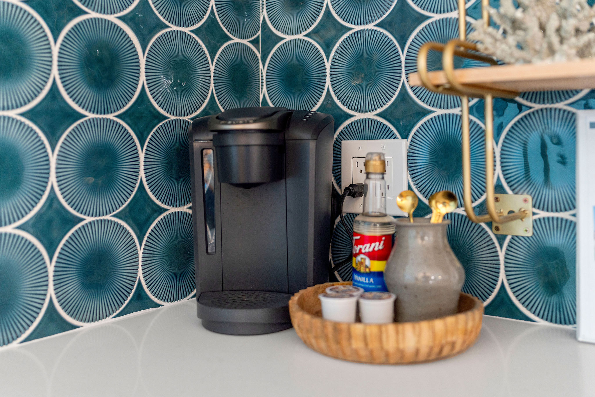 Coffee station at the wet bar includes a Keurig, a drip coffee pot, a few k-cups, vanilla syrup and plenty of cups for your perfect morning cup!