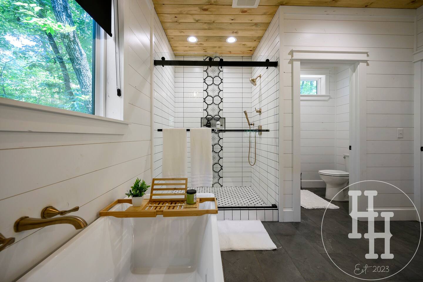 Enjoy our large bath tub with a tray for your favorite book and beverage.