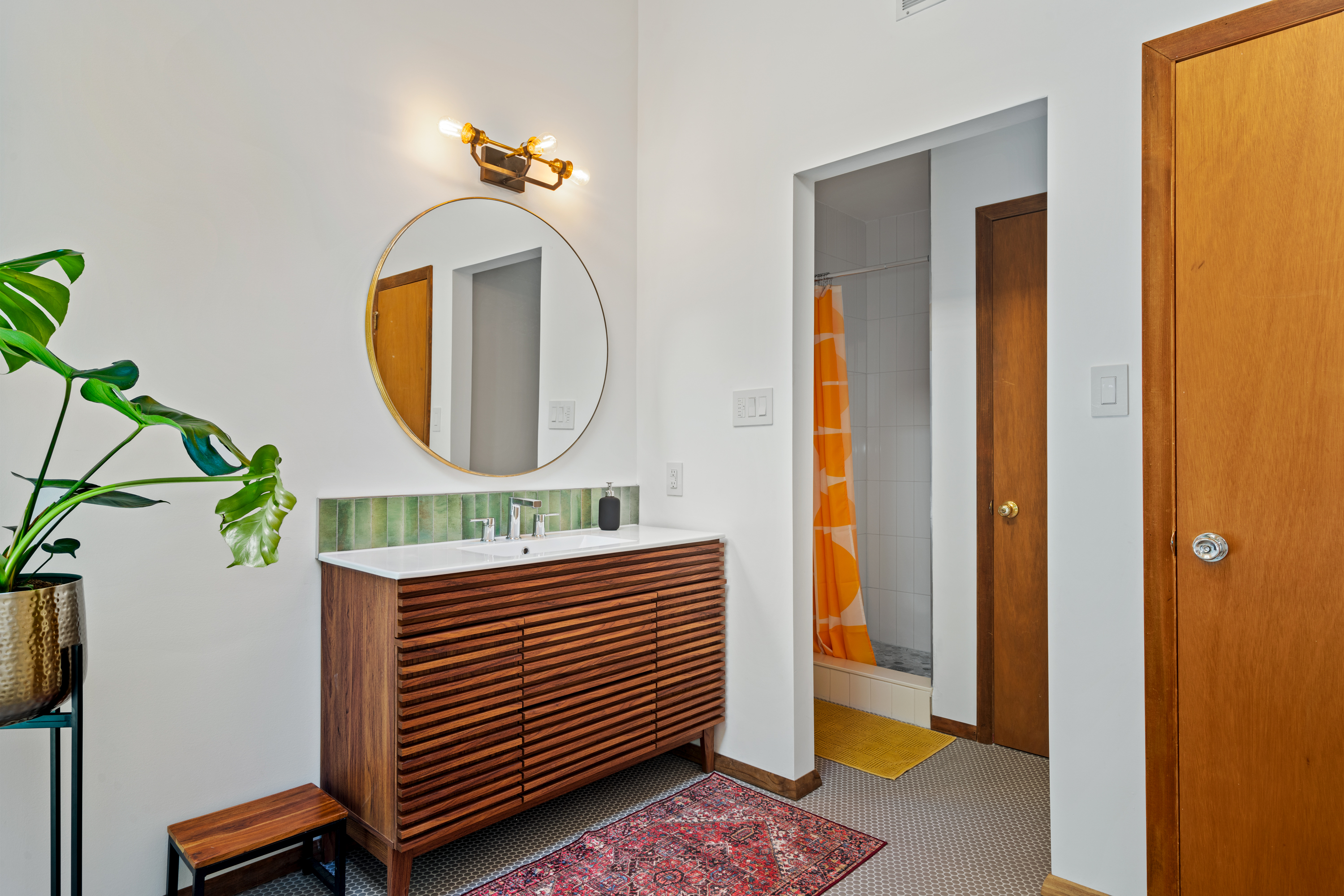 Master bath showing shower and vanity