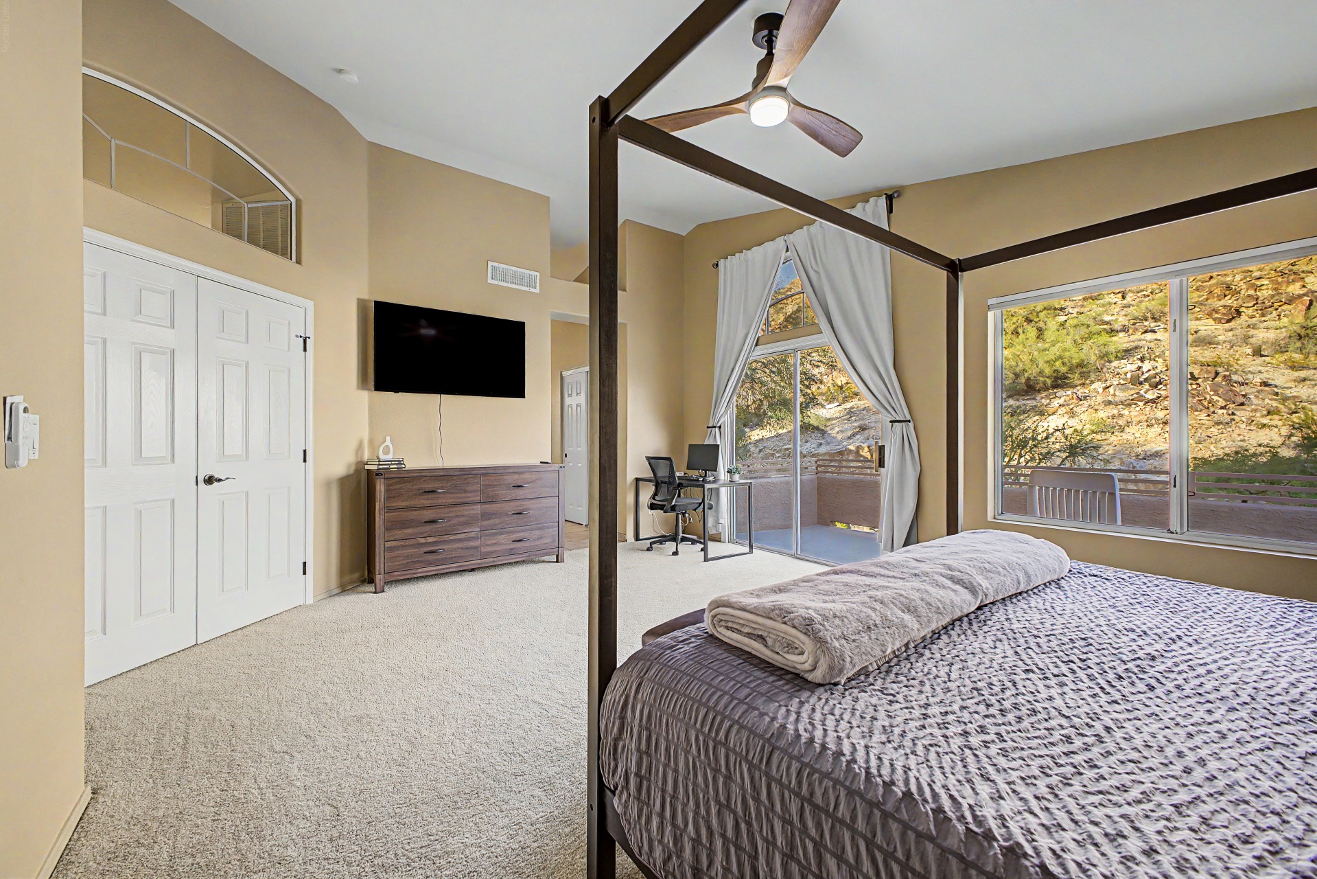 Primary Suite: Bright retreat with king bed, ensuite bathroom, walk in closet, 55" TV, remote workstation and stunning mountain views from your private deck!