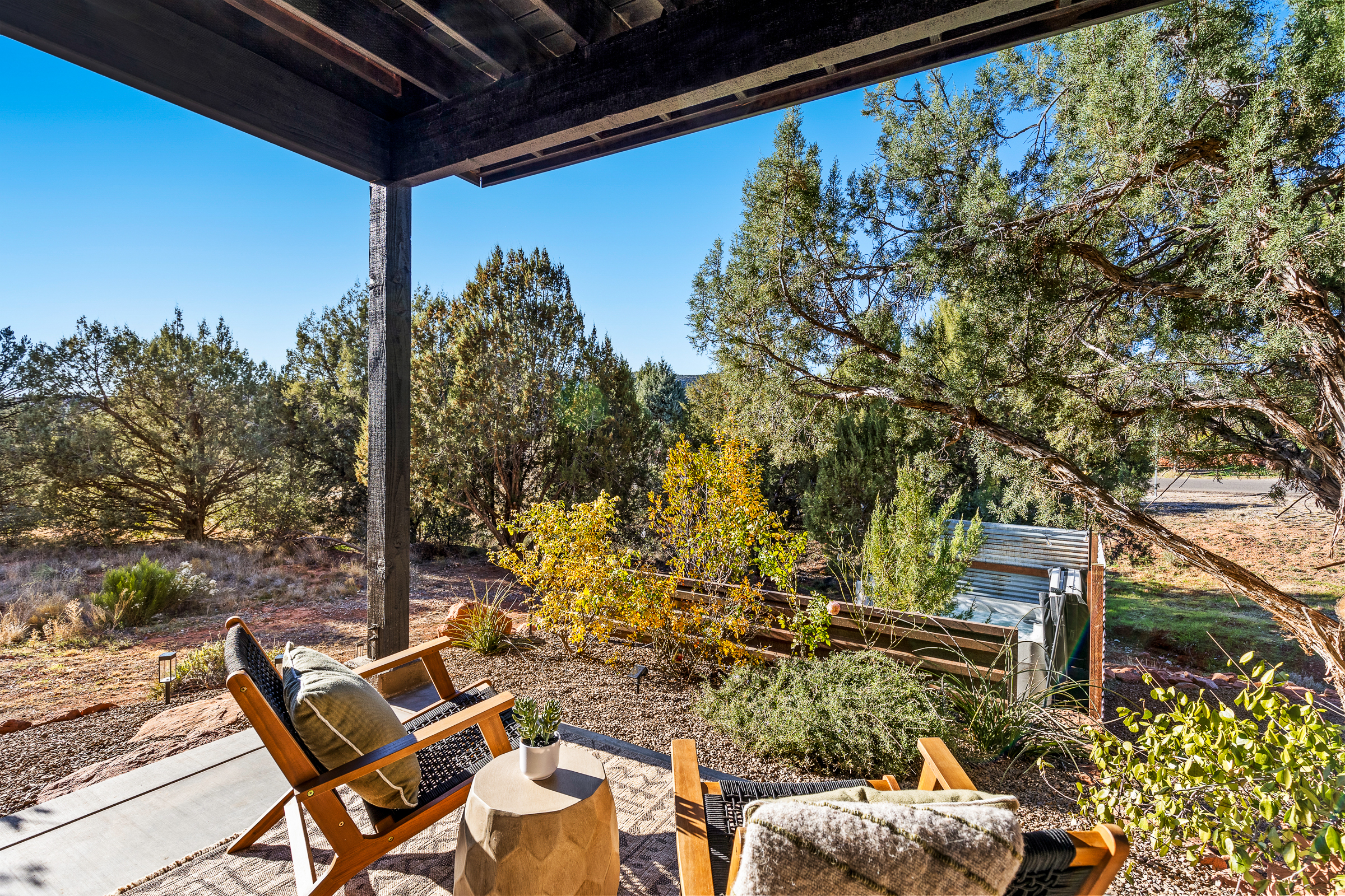 Relax on the private guesthouse patio with comfortable seating, peaceful desert views, and a tranquil Sedona setting.