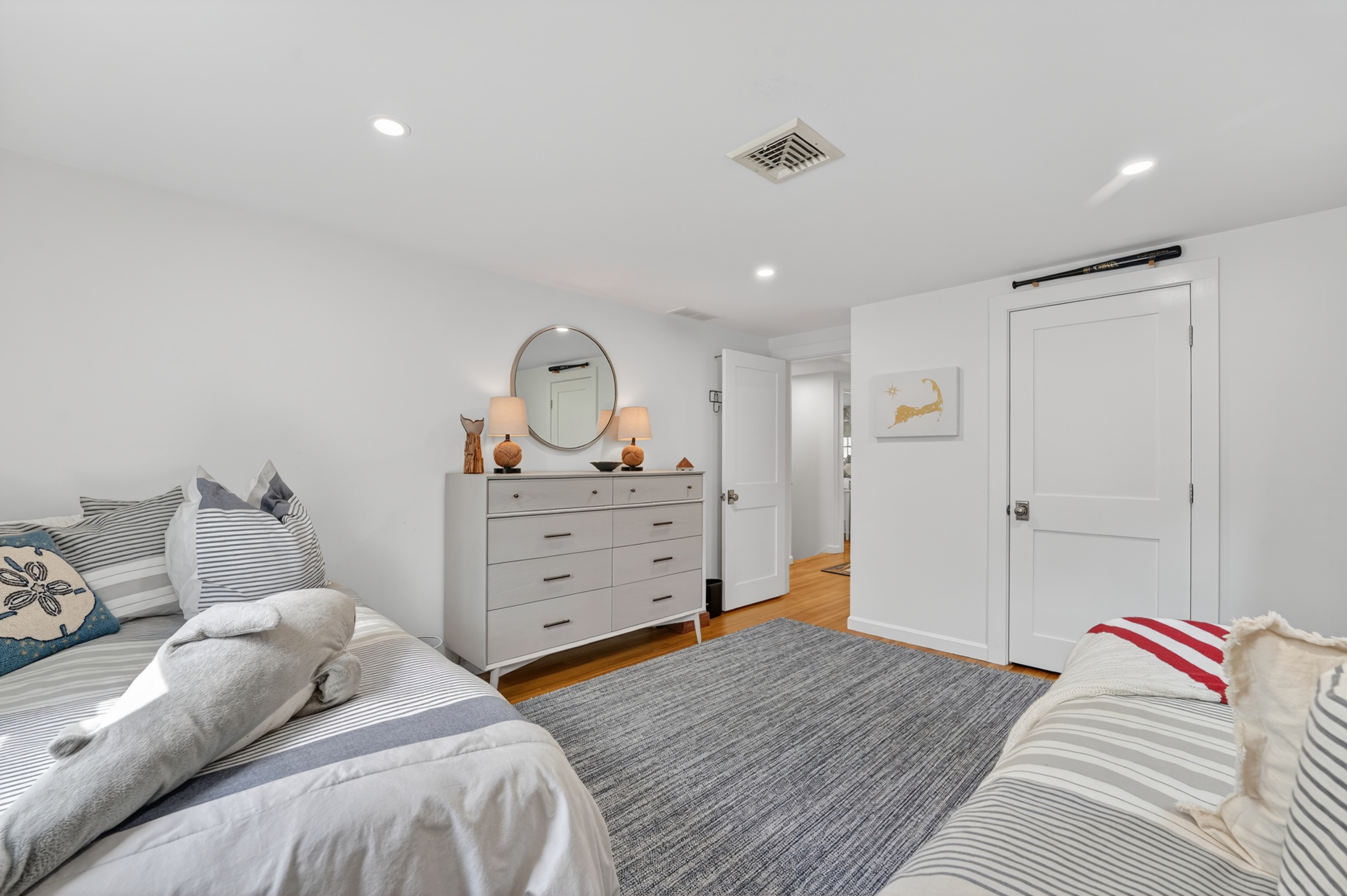 A warm and roomy fourth bedroom featuring twin double beds for extra comfort!