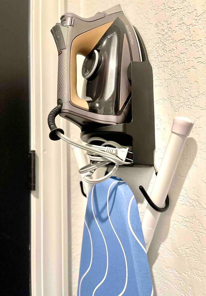 Iron and ironing board located in the laundry room