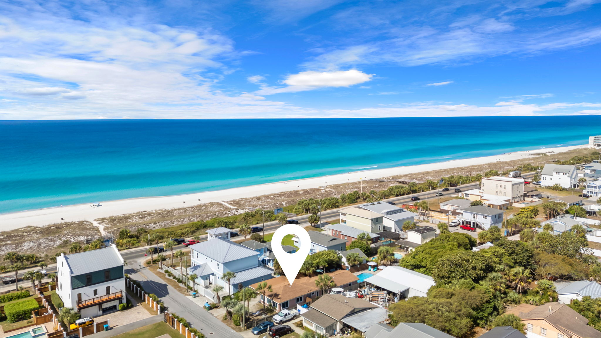 You're just a short stroll from the Gulf. This aerial shows exactly how close Salt & Sway sits to white-sand beach access, with turquoise water visible from your own backyard.