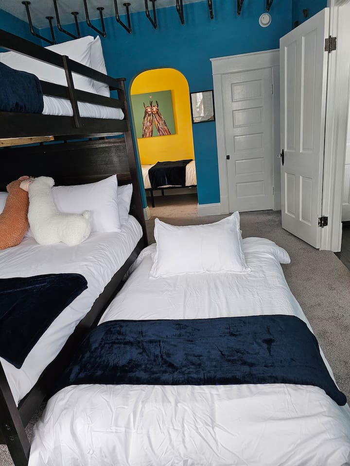 Sleep up to 6 in the pull out twin trundle bed, full over full bunk beds and twin bed in the Machu Picchu Bunk Room.