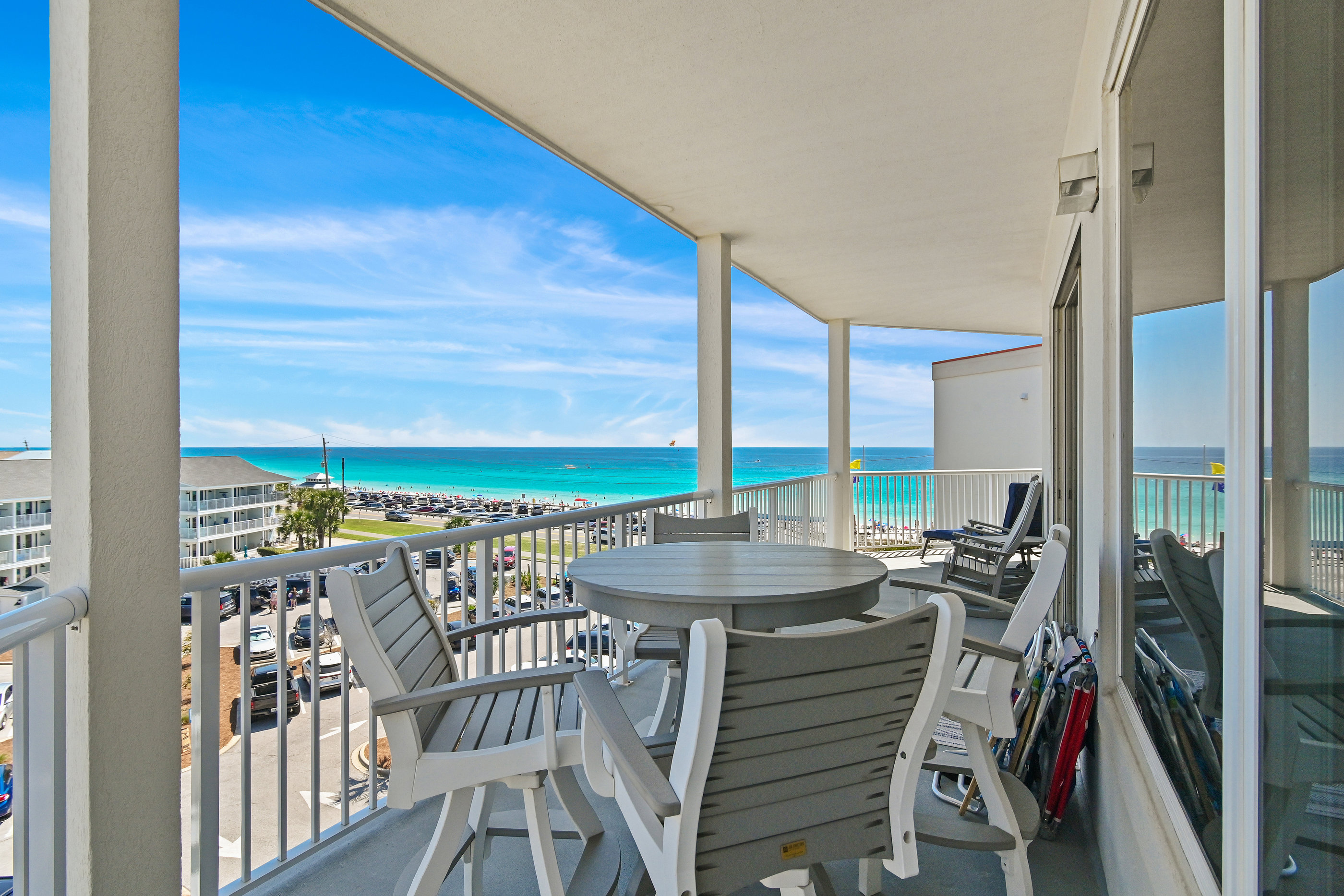 Balcony seating overlooking the sugar‑white sand