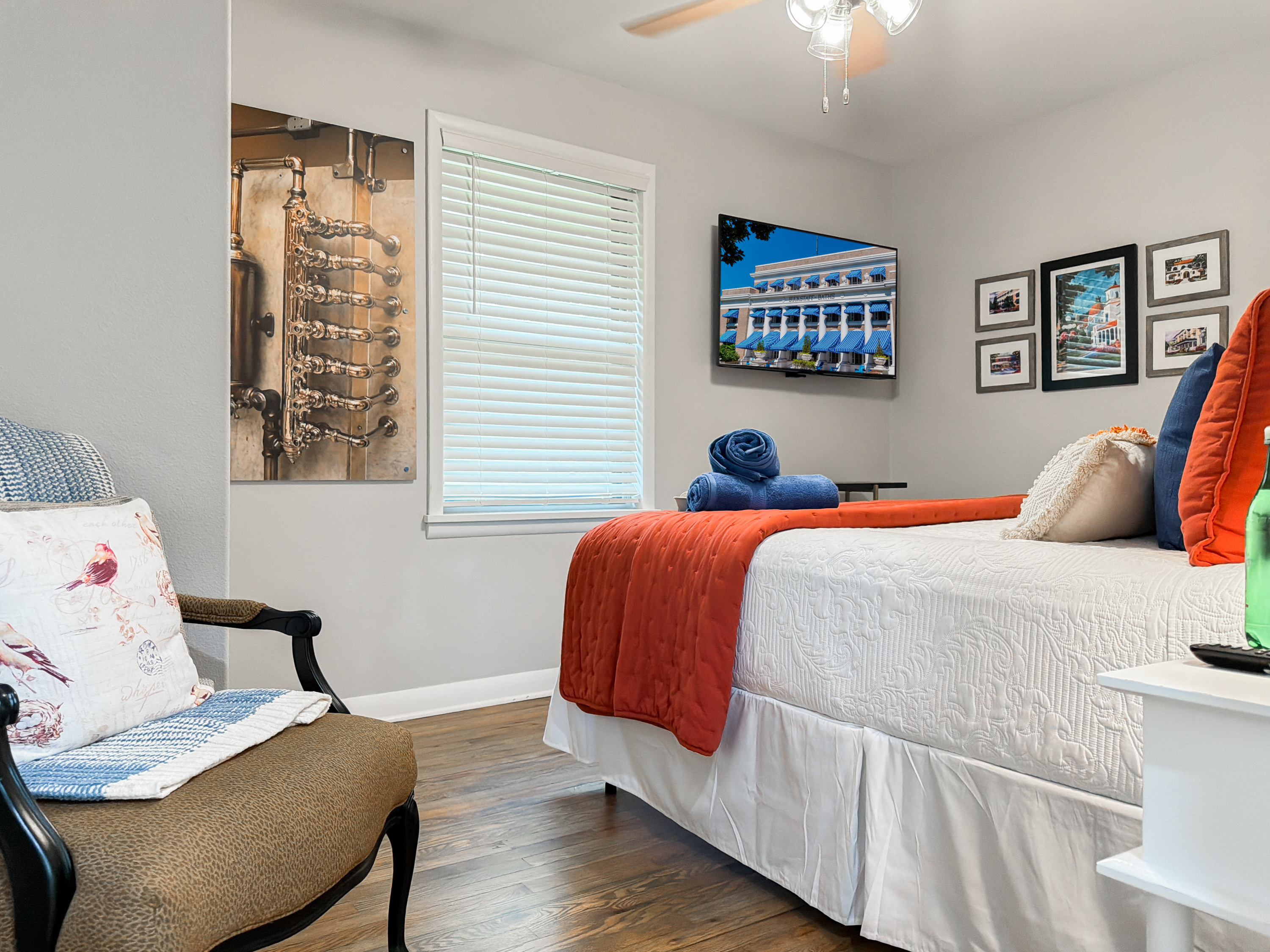 Sleep under the Bathhouse Row mural in the Bathhouse King — Hot Springs character built right into the room.
