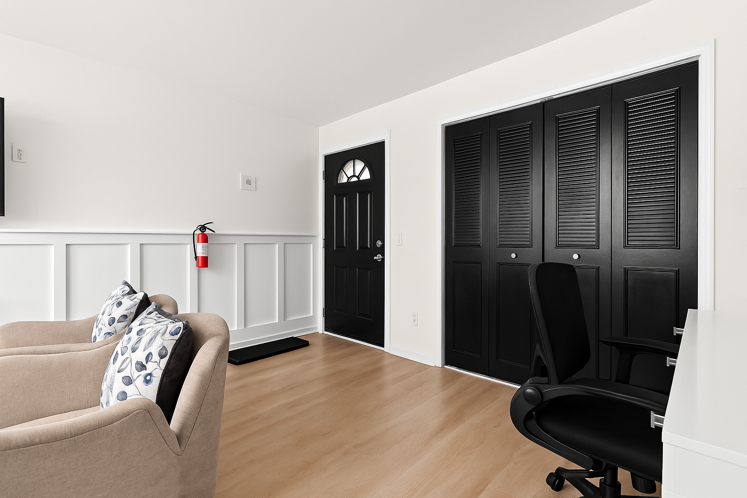 A seamless flow from living room to entryway, featuring bold accents and bright natural light.