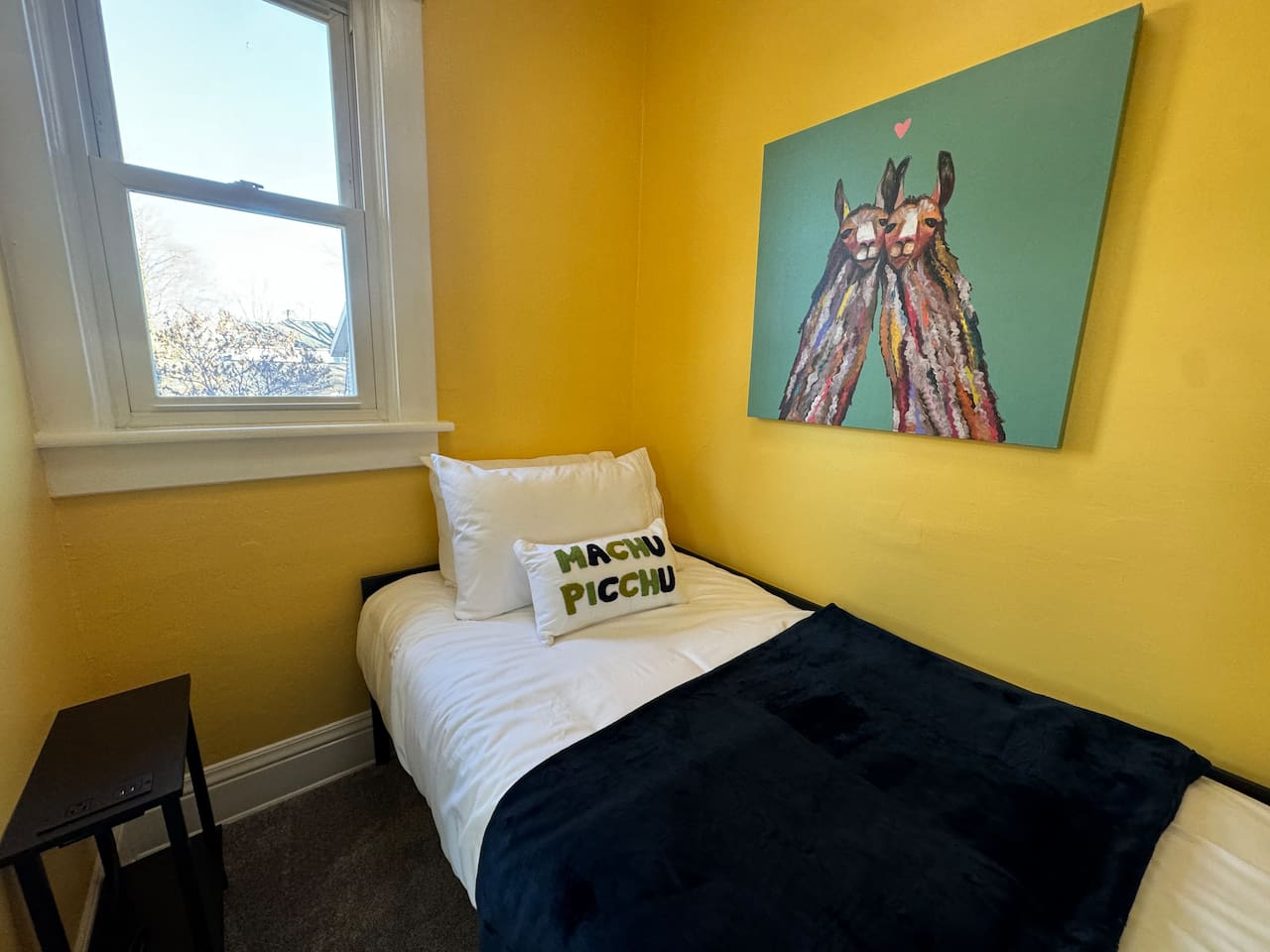 Twin bed in the alcove of the Machu Picchu Room.
