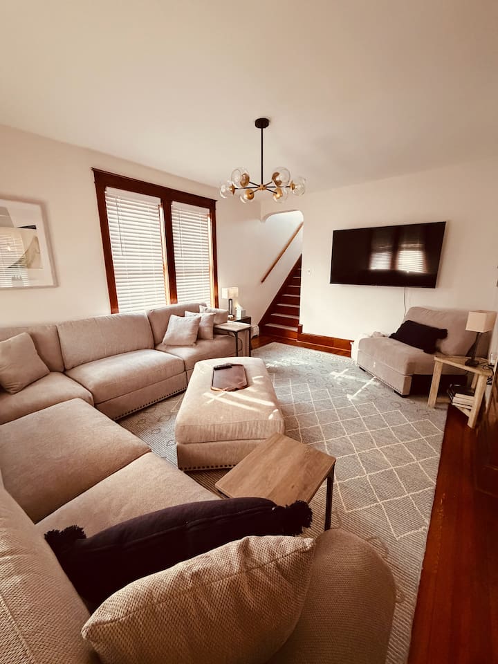 Spacious living room with large sectional — perfect for relaxing after a day exploring Gettysburg