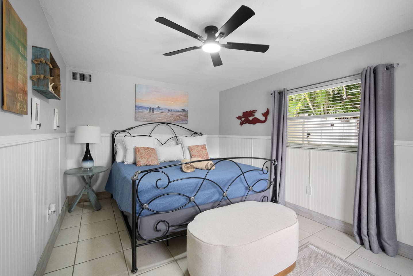 Bedroom number 4, located closest to the entry door next to the kitchen, has a queen bed