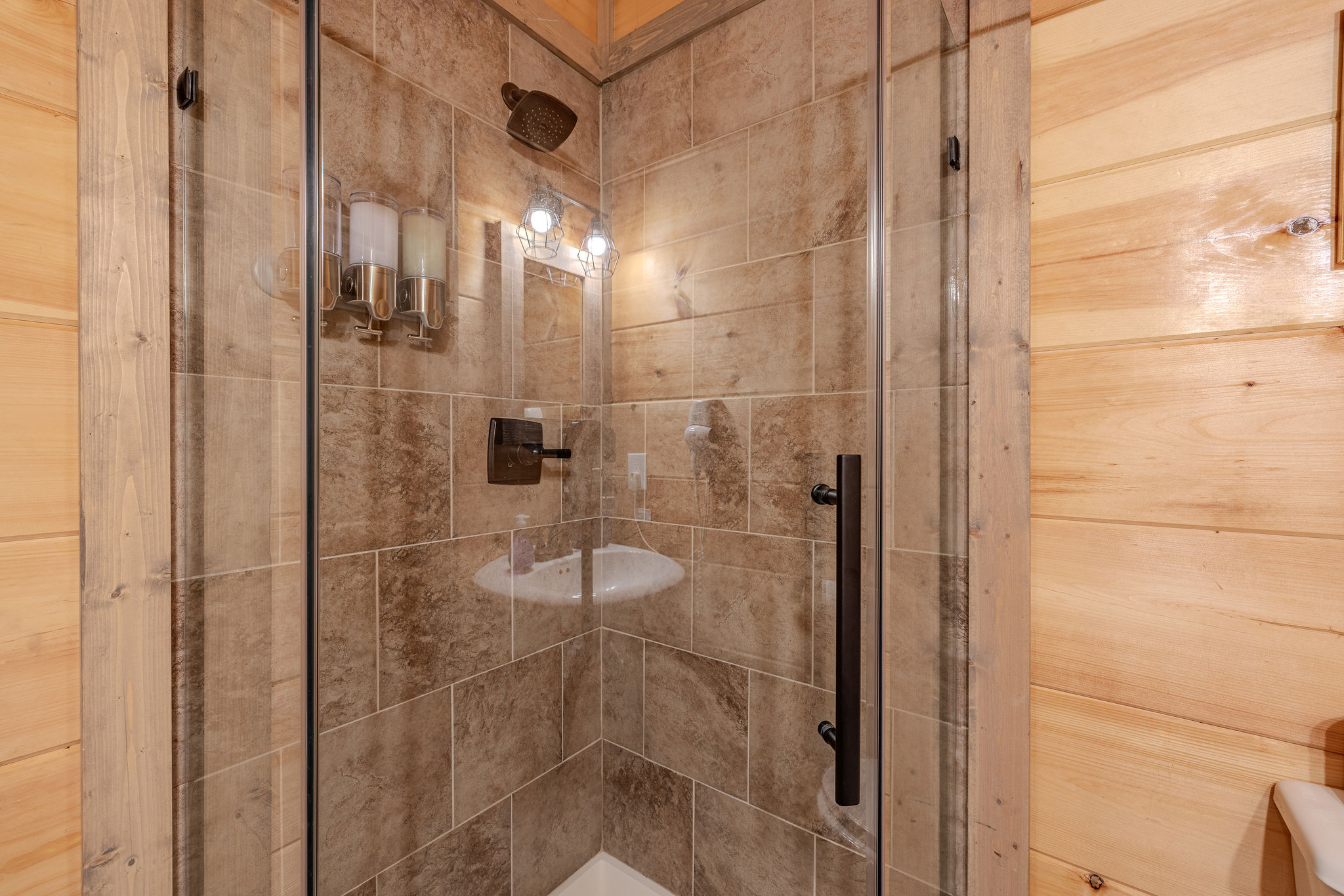 A second view of the lower-level shared bathroom with shower and guest-ready essentials.