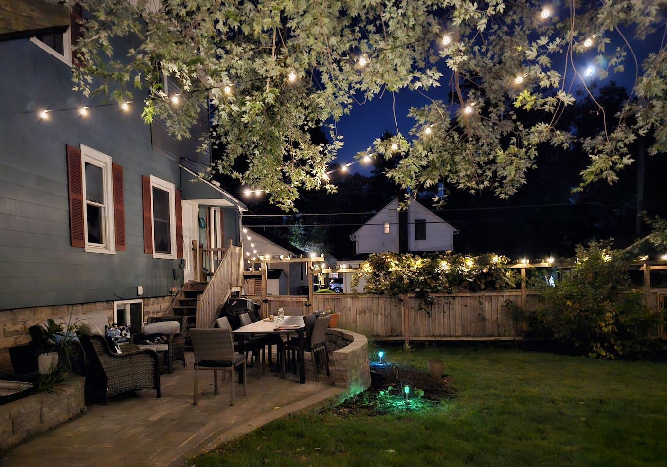 Private and spacious fenced yard is a lovely place to come together during the day and at night.