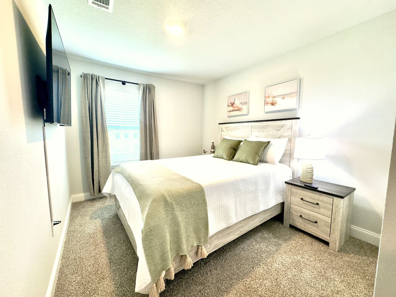 Crisp white linens, a cozy throw at your feet. Sheer curtains glow with soft daylight. Calm, quiet, ready to let go.
