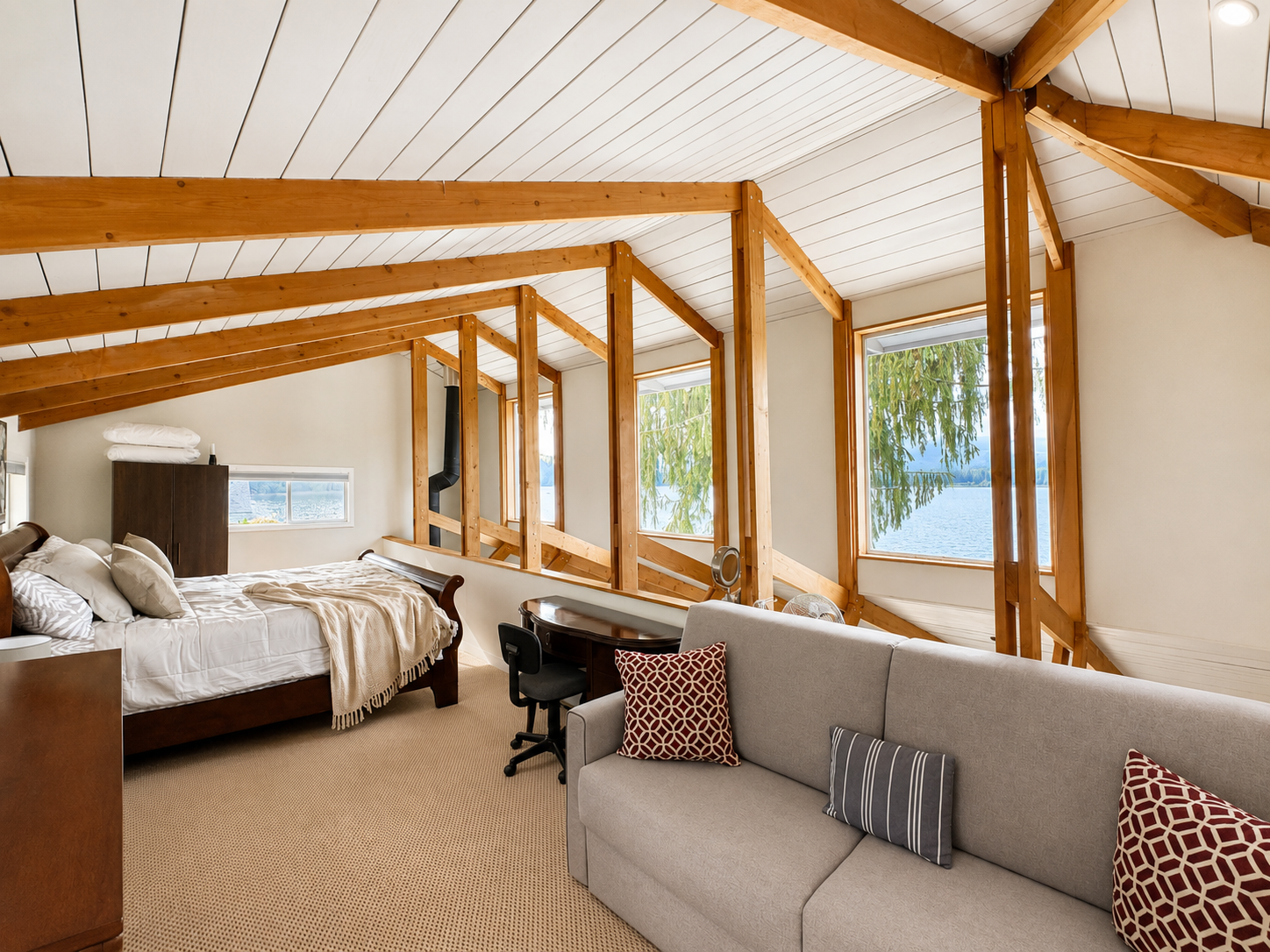 Bedroom 1 King. King bedroom with beautiful views overlooking the lake, creating a peaceful setting to wake up and unwind.