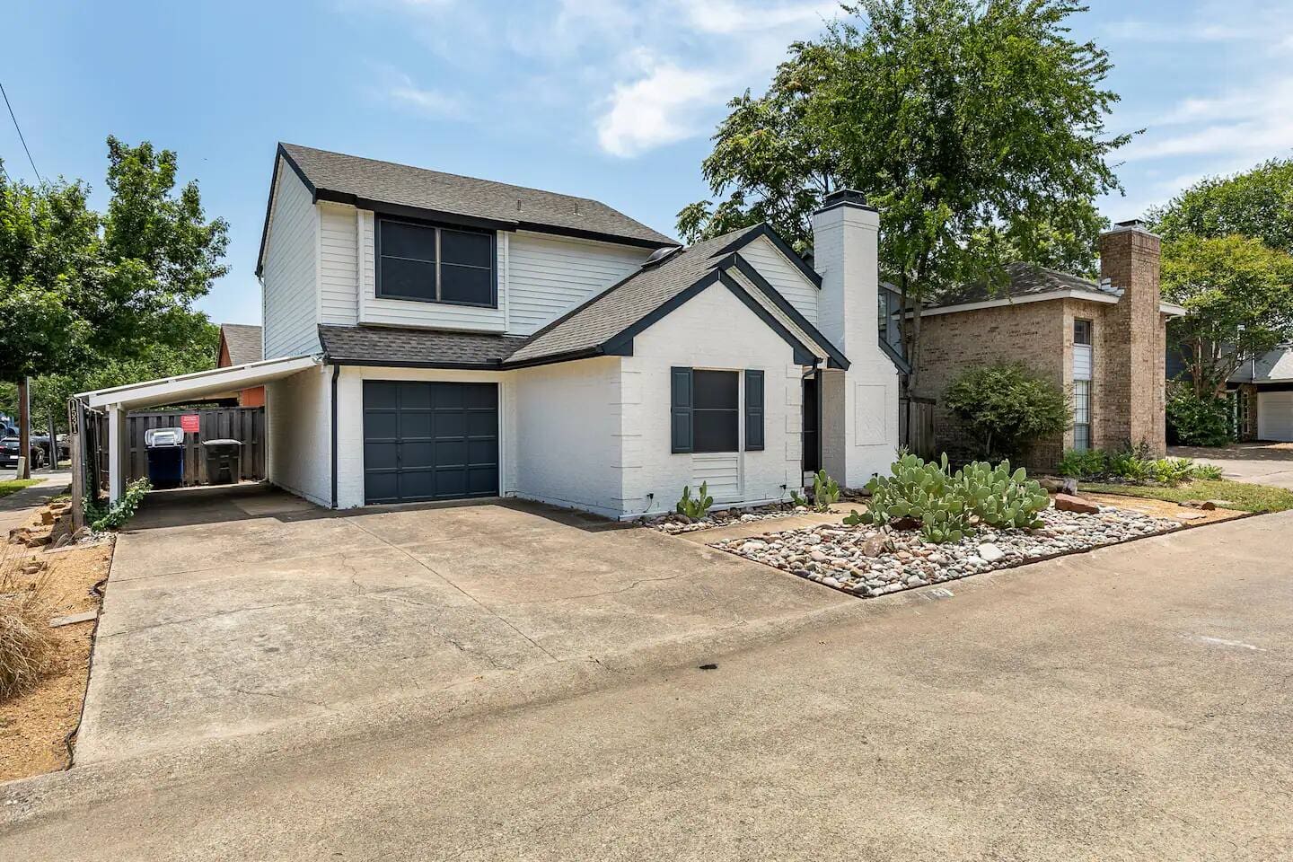Exterior view of home with private driveway and modern design.
