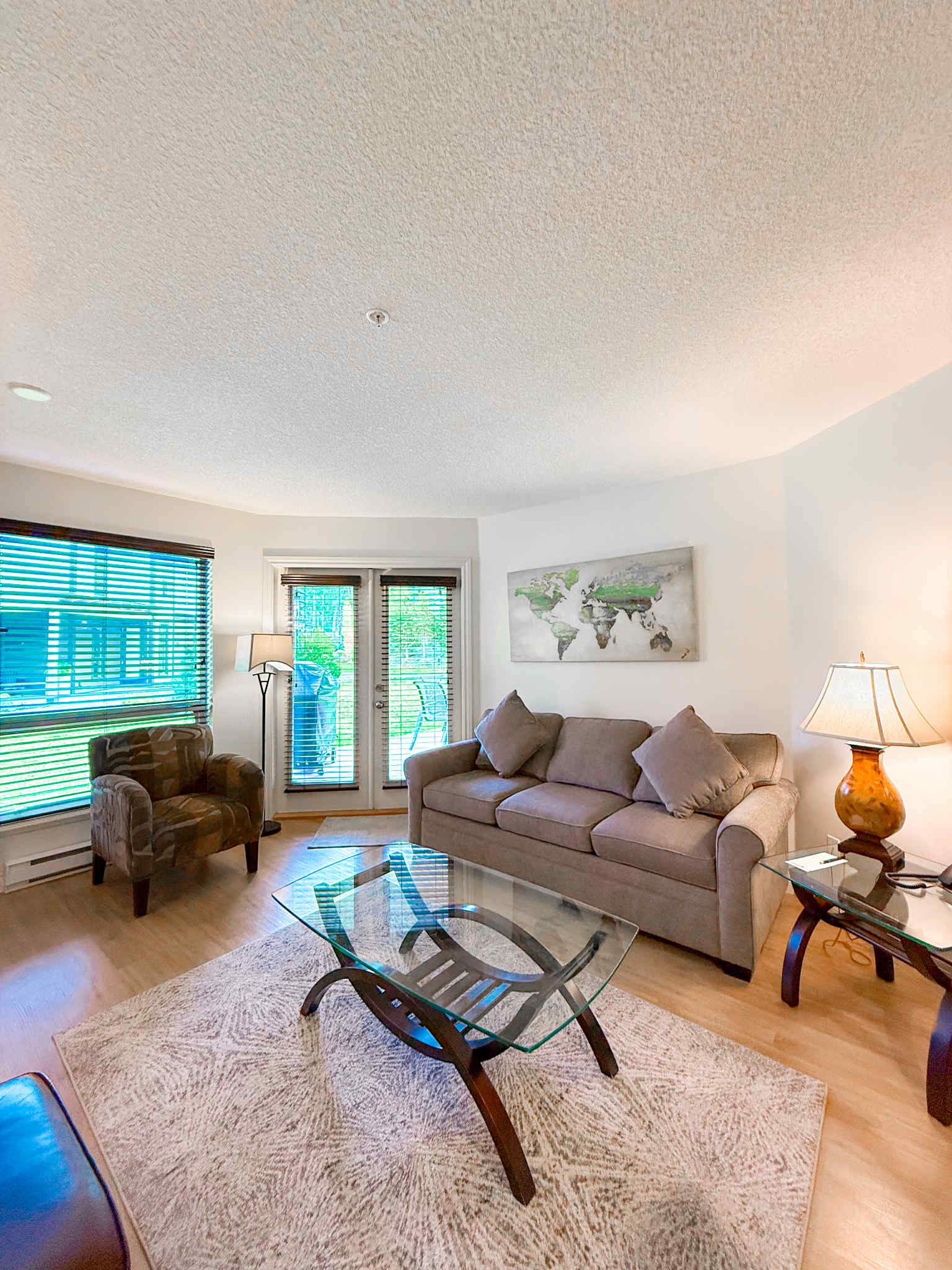 Unit A  - Living room with double glass Patio doors.