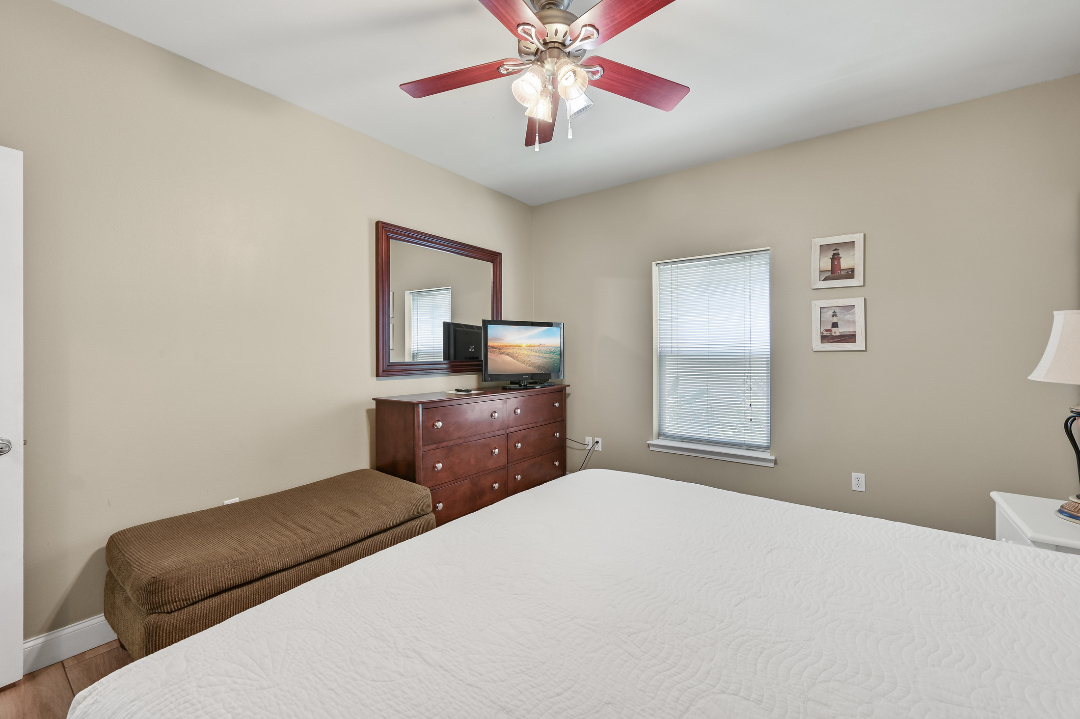 BEDROOM #1: King Bed with nightstands, dresser, and TV. (located on the 1st floor)