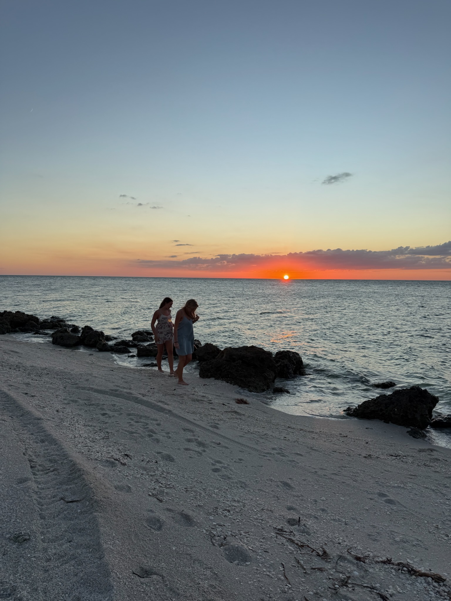 Sunset walks looking for shells along the beach 