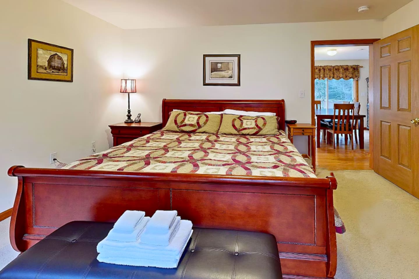 Main bedroom of home is located right on first floor with attached bathroom and a king sized bed!