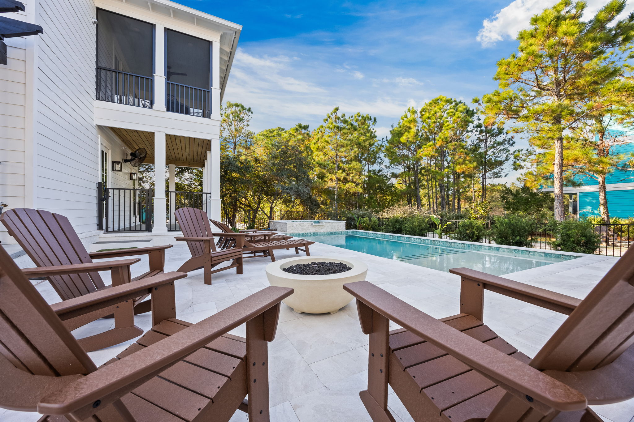 Relax around the poolside fire pit in comfortable Adirondack chairs, just steps from the private pool and spa—your go-to spot for unwinding, conversation, and memorable nights under the coastal sky.