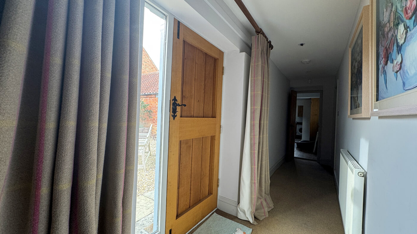 The Courtyard corridor to the three bedrooms also has an external door to the parking courtyard.