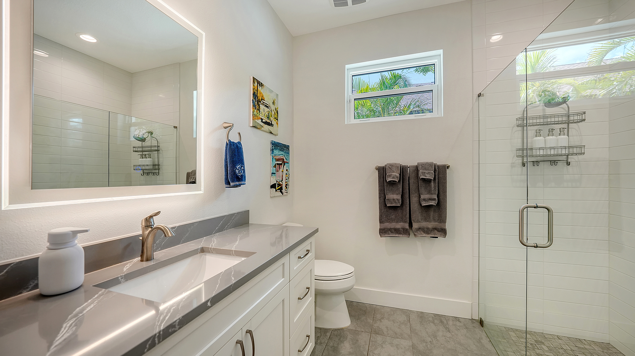 Backlit vanity and spa-quality bath products in the 2nd bathroom in between the two Queen bedrooms