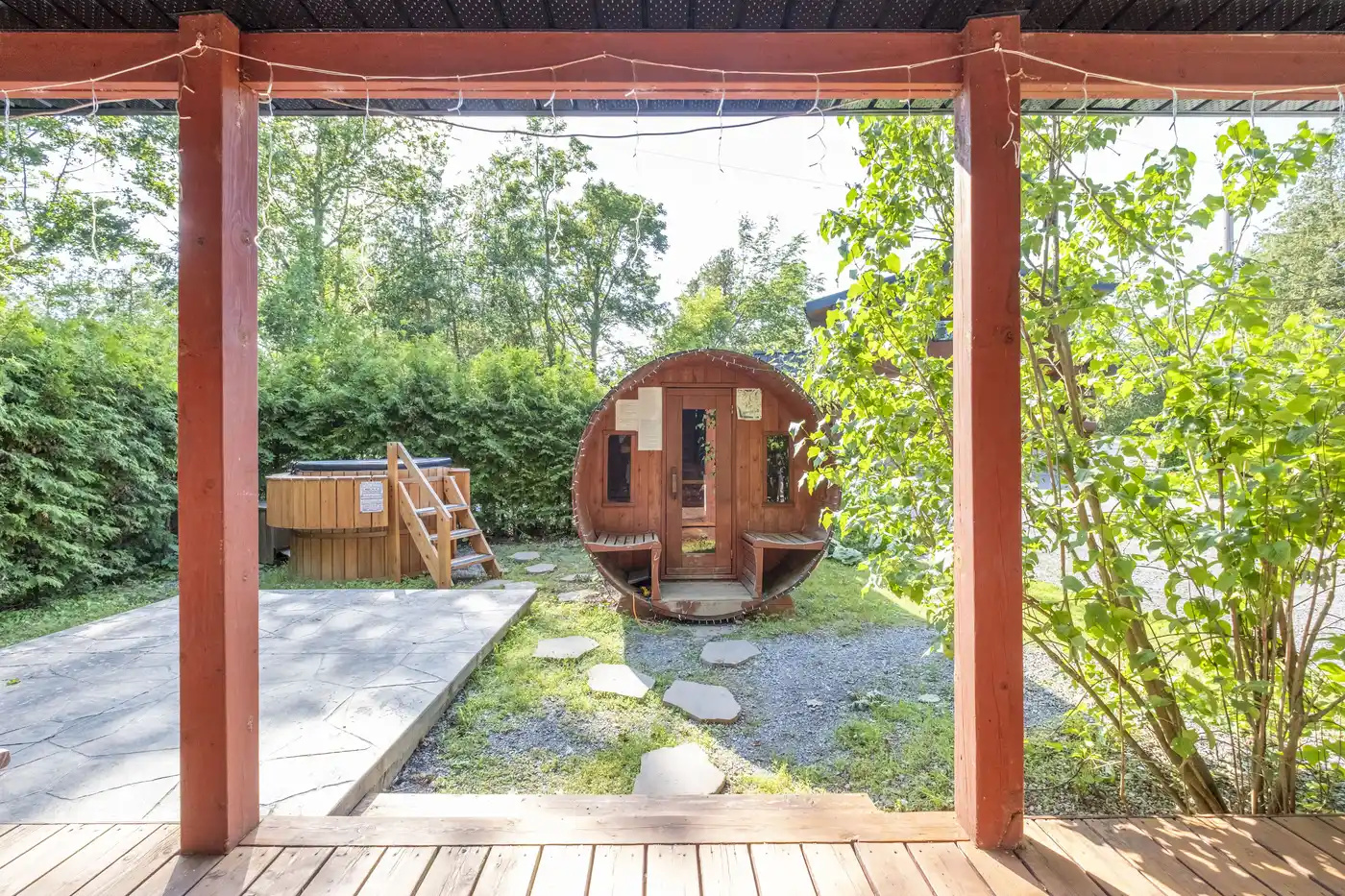 View from the covered porch toward the private barrel sauna