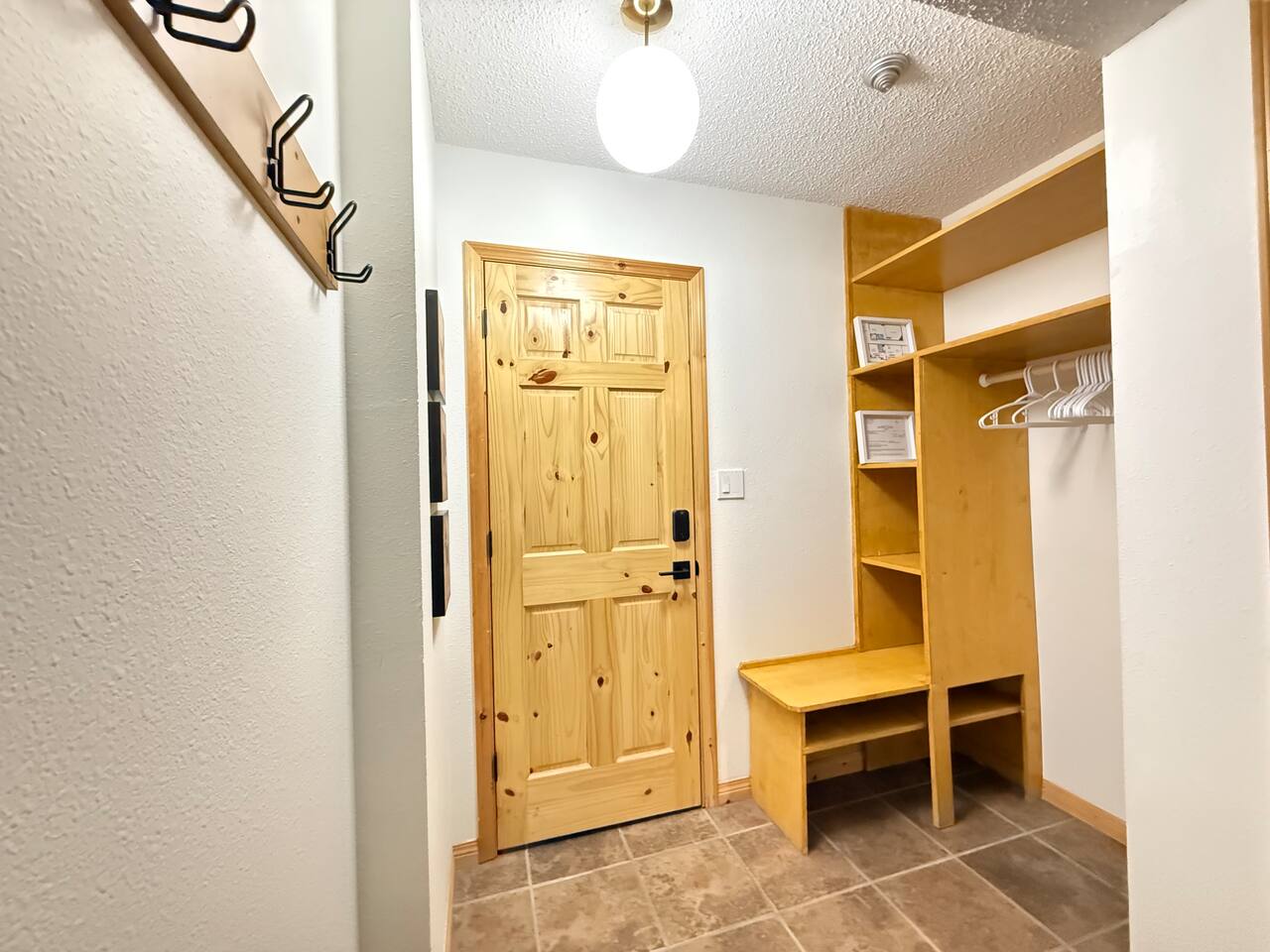 Gear Cubbies: Maximize organization with these built-in cubbies and shelving, providing dedicated storage for footwear, helmets, and gear right by the door.