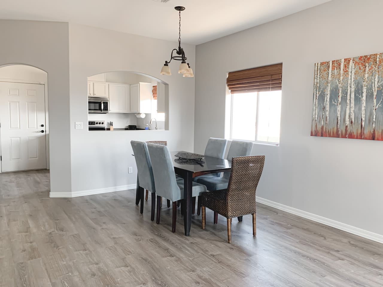 Bright dining area with seating for 6, conveniently located off the kitchen.