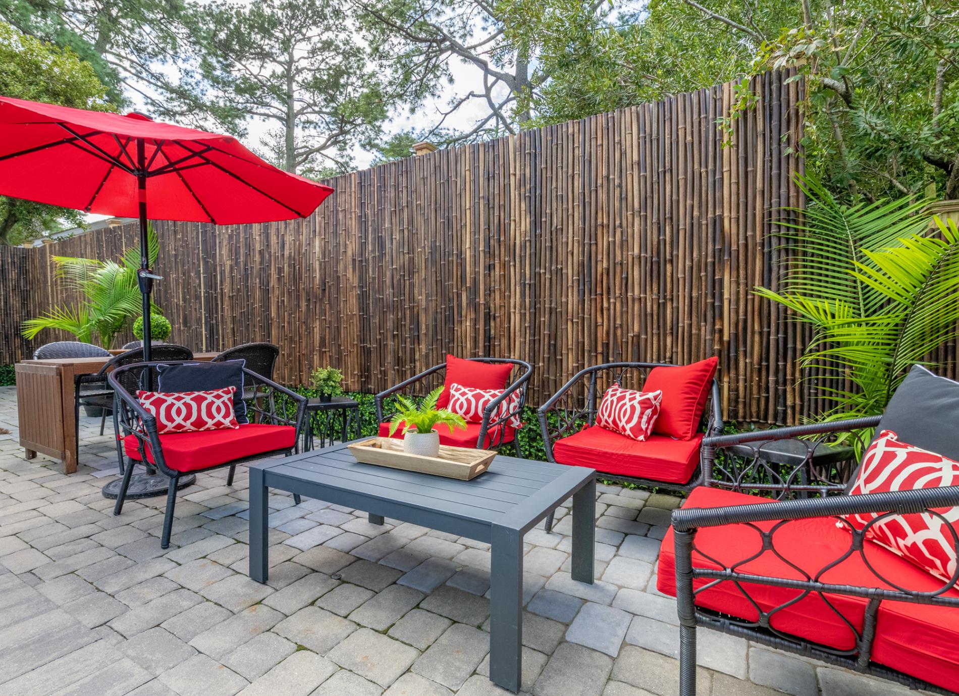 Enjoy the pool from this seating area