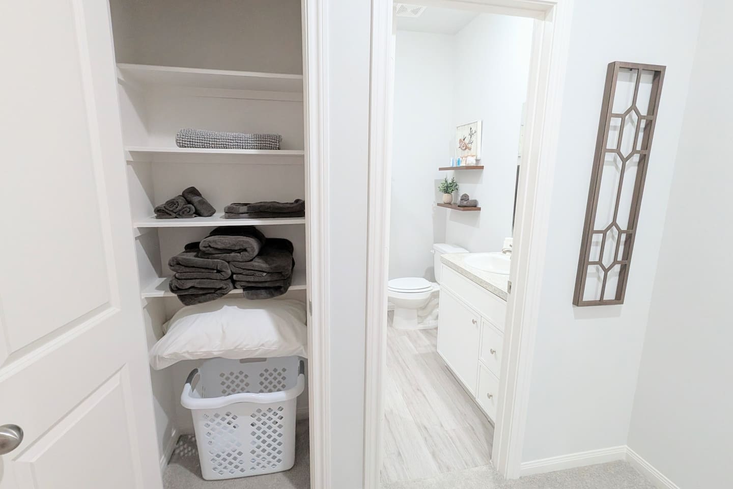 Linen closet is conveniently located outside the bathroom. 
