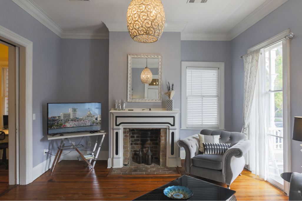 Historic details meet modern comfort with the original decorative fireplace as a standout feature.