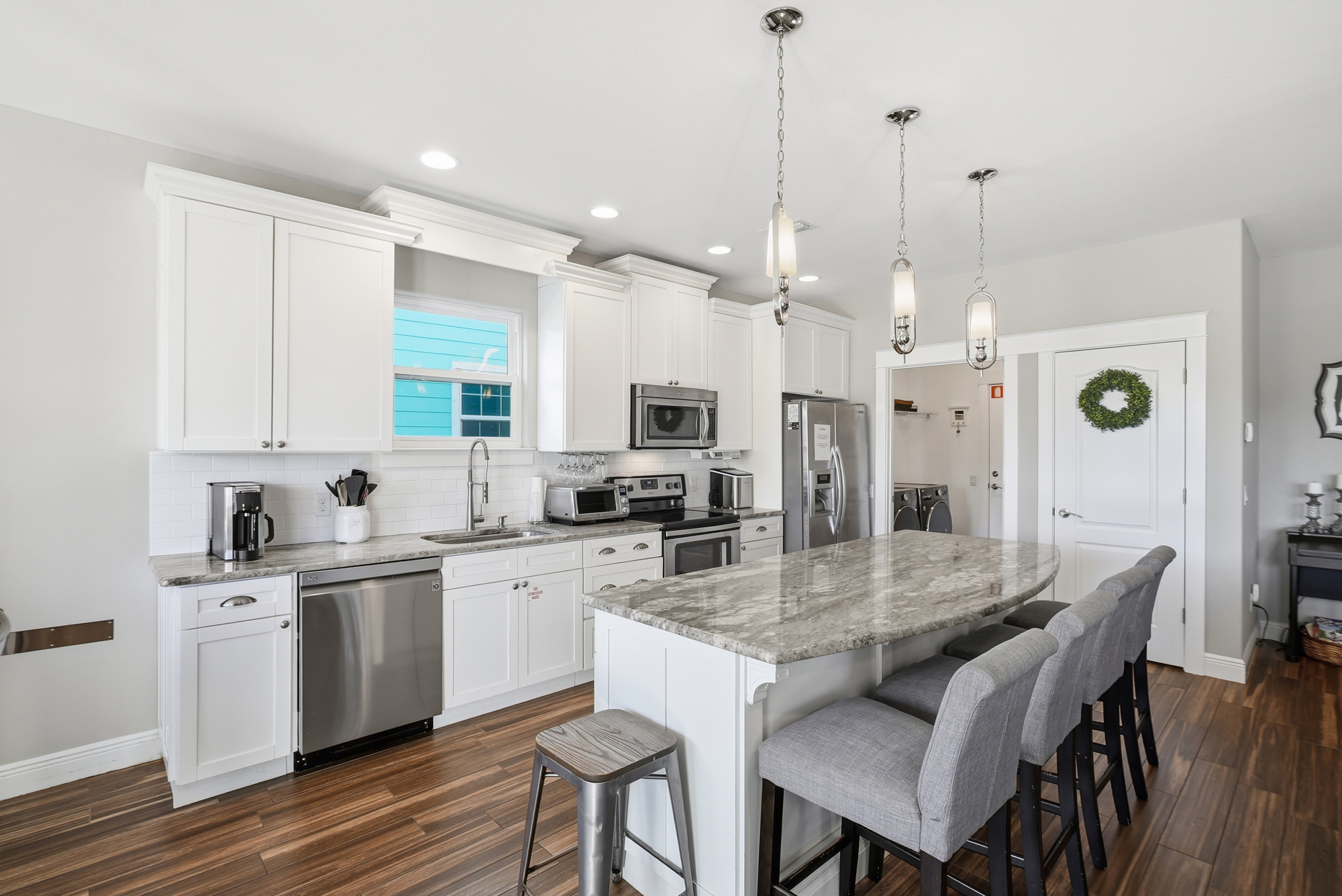 Clean, spacious kitchen ready for everything from complimentary coffee to family dinners.