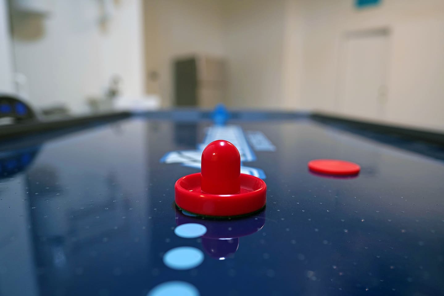Air conditioned and heated garage space includes tons of games like foosball, air hockey, and shuffleboard.