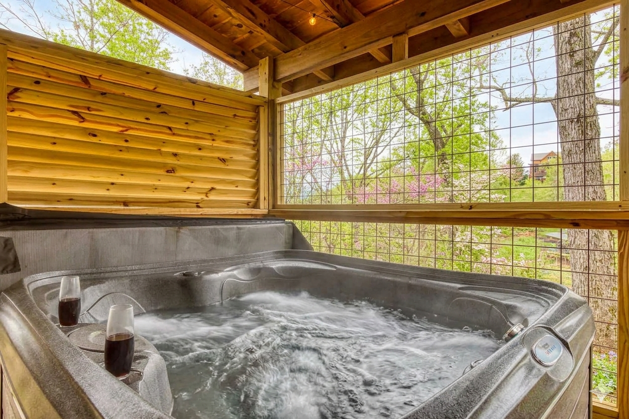 Enjoy a warm soak in the private hot tub while you listen to the breeze move through the trees