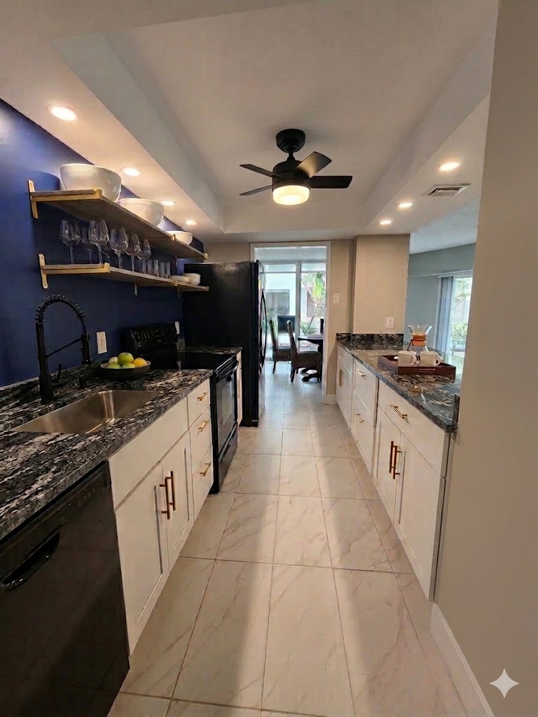 Kitchen with 4 barstools on other side, new appliances, water/ice maker on fridge.