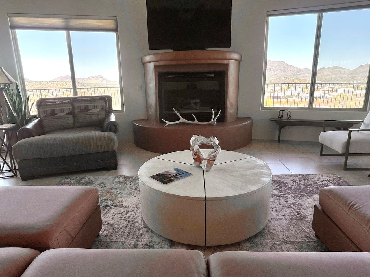 Multiple seating areas make this living room easy for everyone to settle in comfortably.