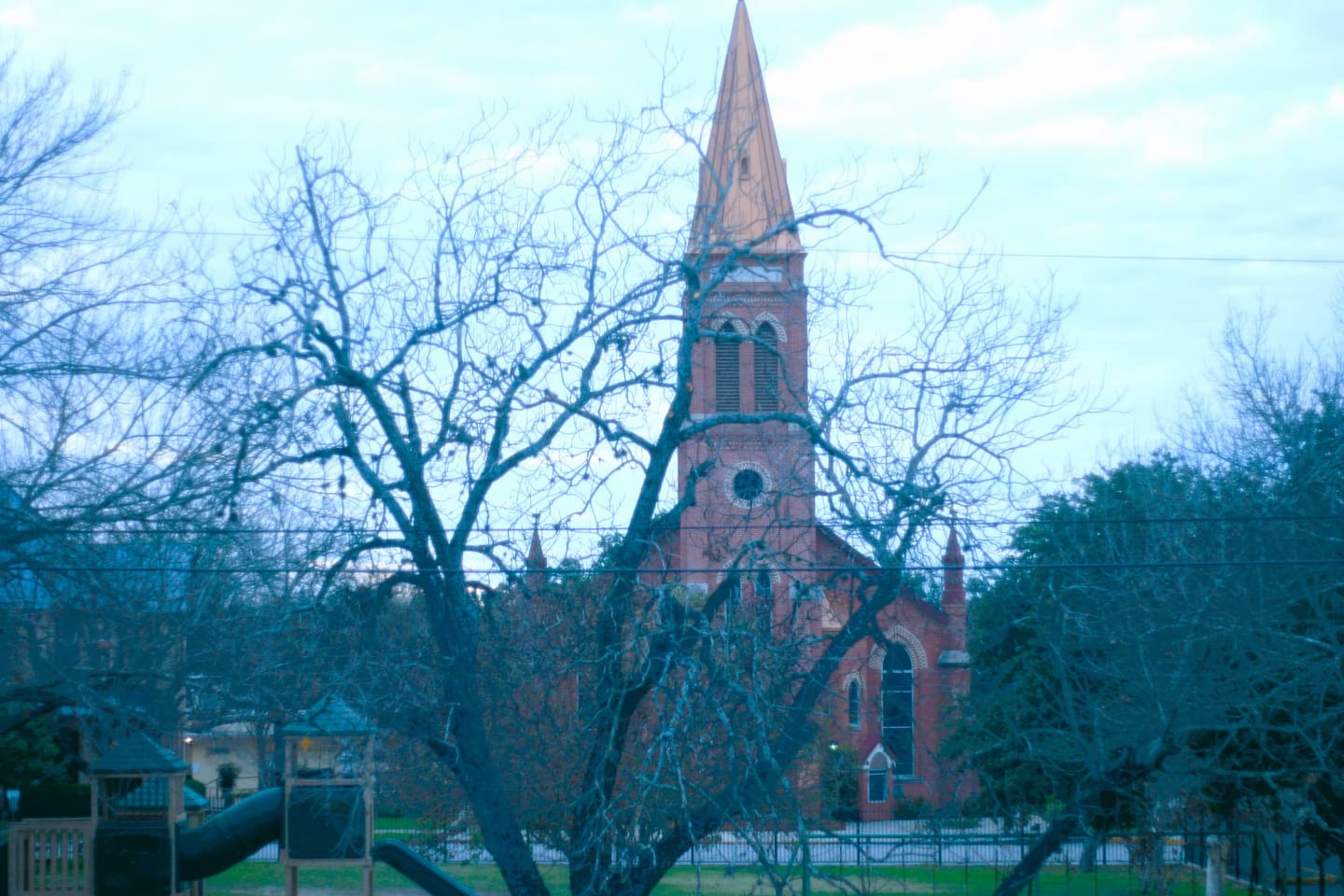 Across the street from St James Catholic Church built in 1854. Hear church bells chiming hourly and giggling children on school playground. 