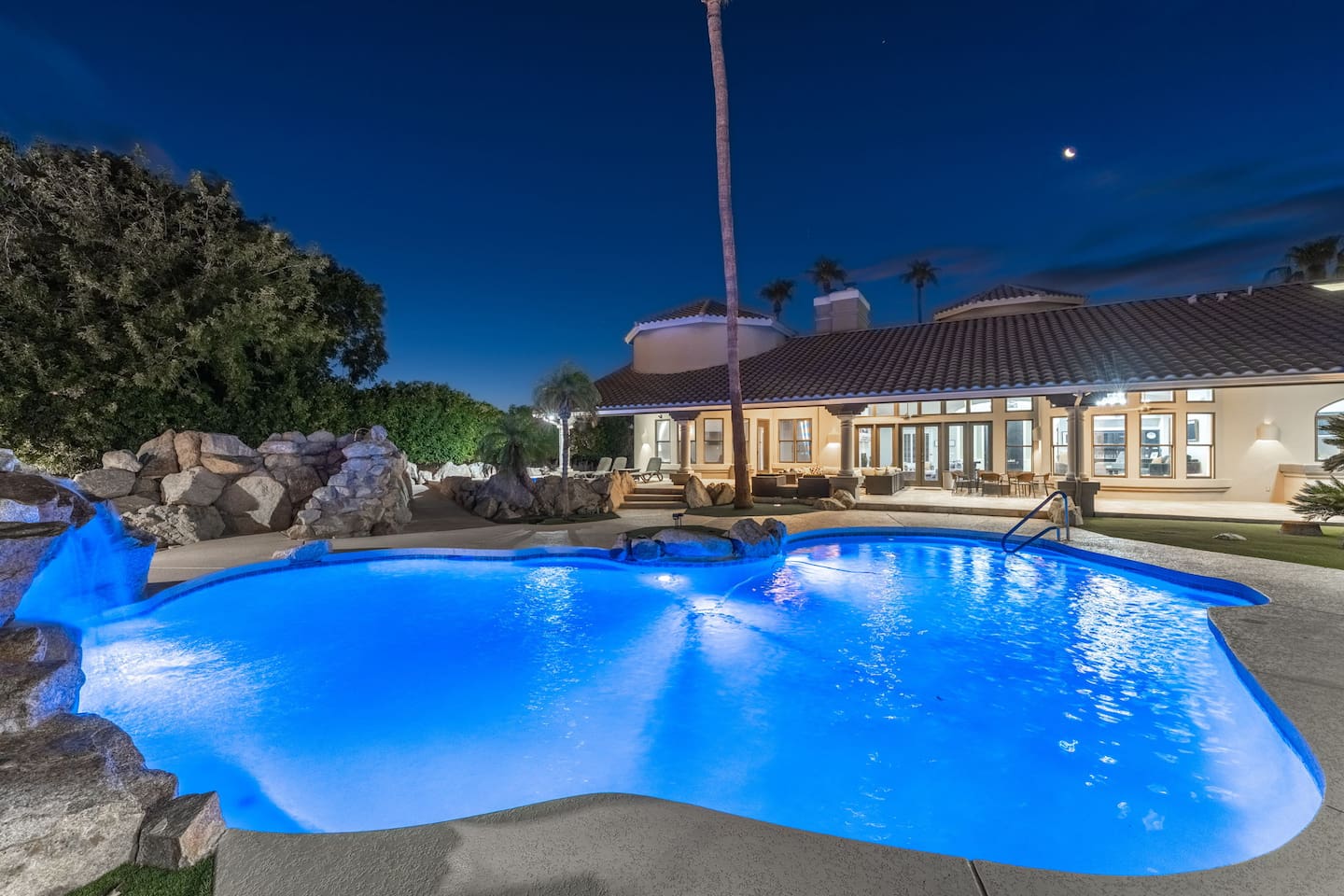 Surround yourself with natural beauty—sparkling pool, stone accents, and a relaxing resort vibe.

