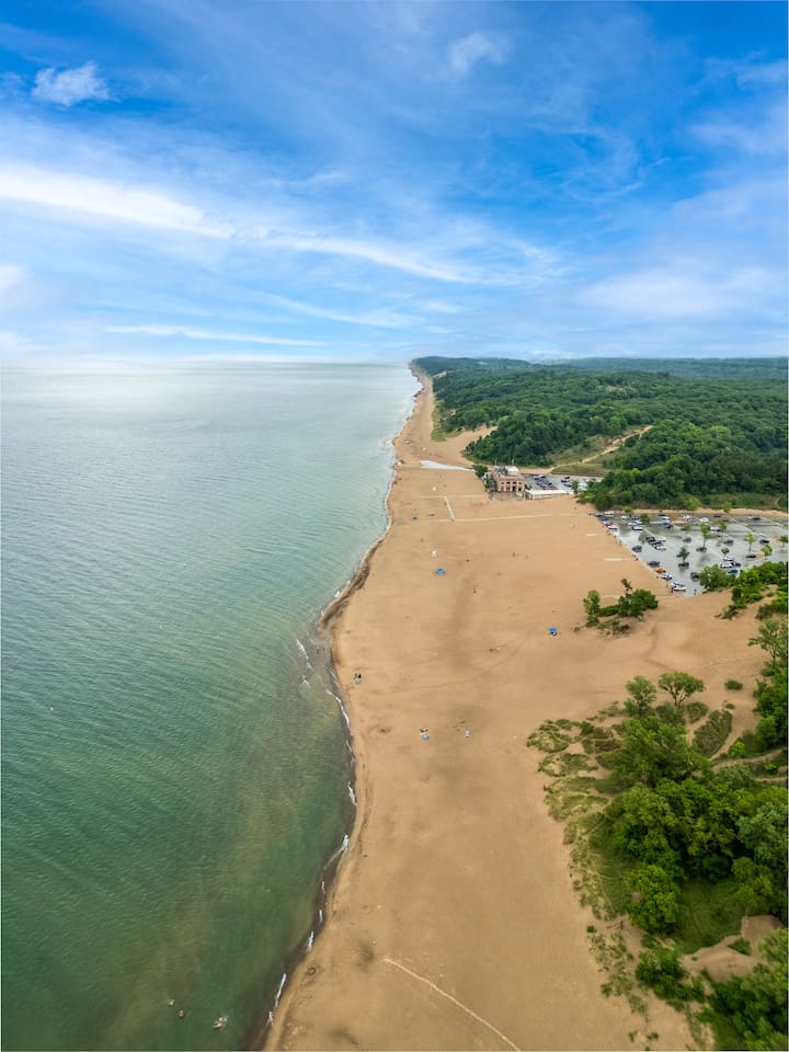 Indiana Dunes National Park lakeshore is located just 20 minutes away driving. Entry is $25 for a private vehicle. If you carry the America the Beautiful National Park Pass, admission is free. There are free beaches located along the Lake Shore.