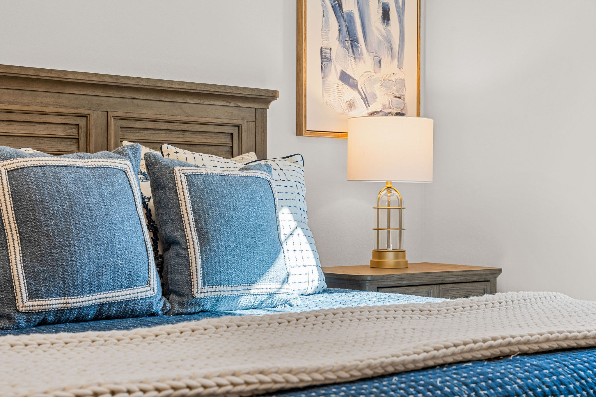 Comfortable bedroom with soft linens and calming tones, perfect for restful nights.