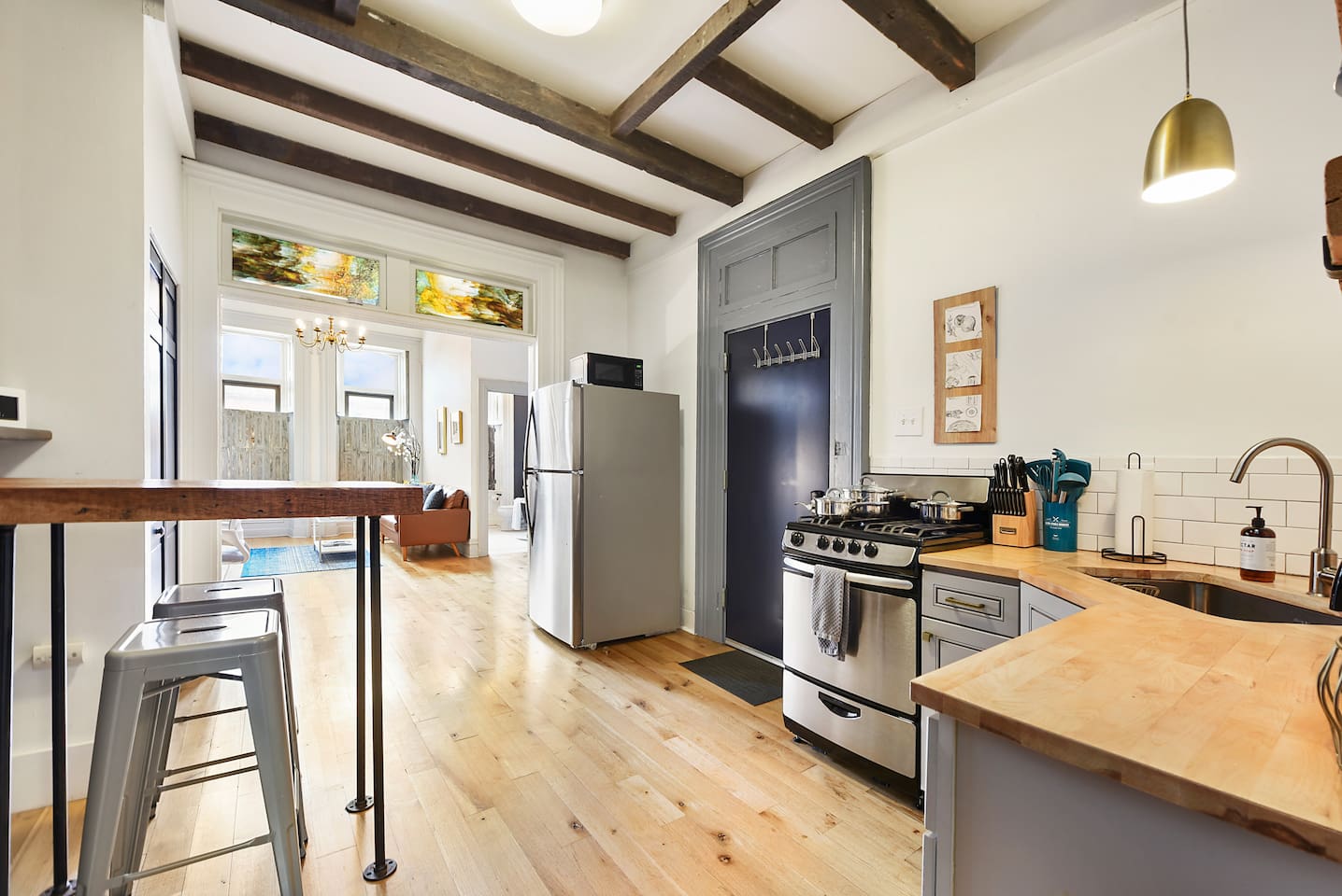 Fully equipped kitchen featuring modern design and sleek stainless steel appliances — ready for all your cooking needs.
