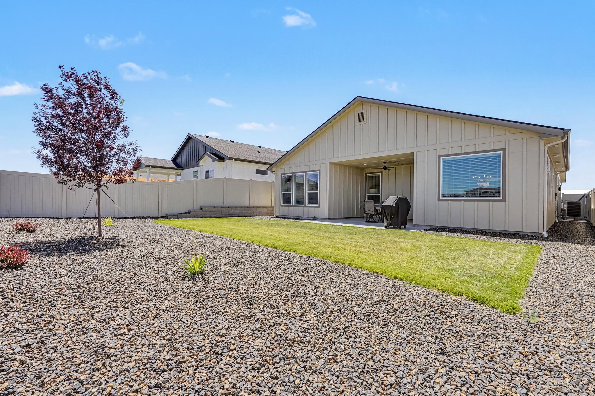 Spacious fully fenced backyard offering privacy and a comfortable outdoor space to enjoy during your stay.